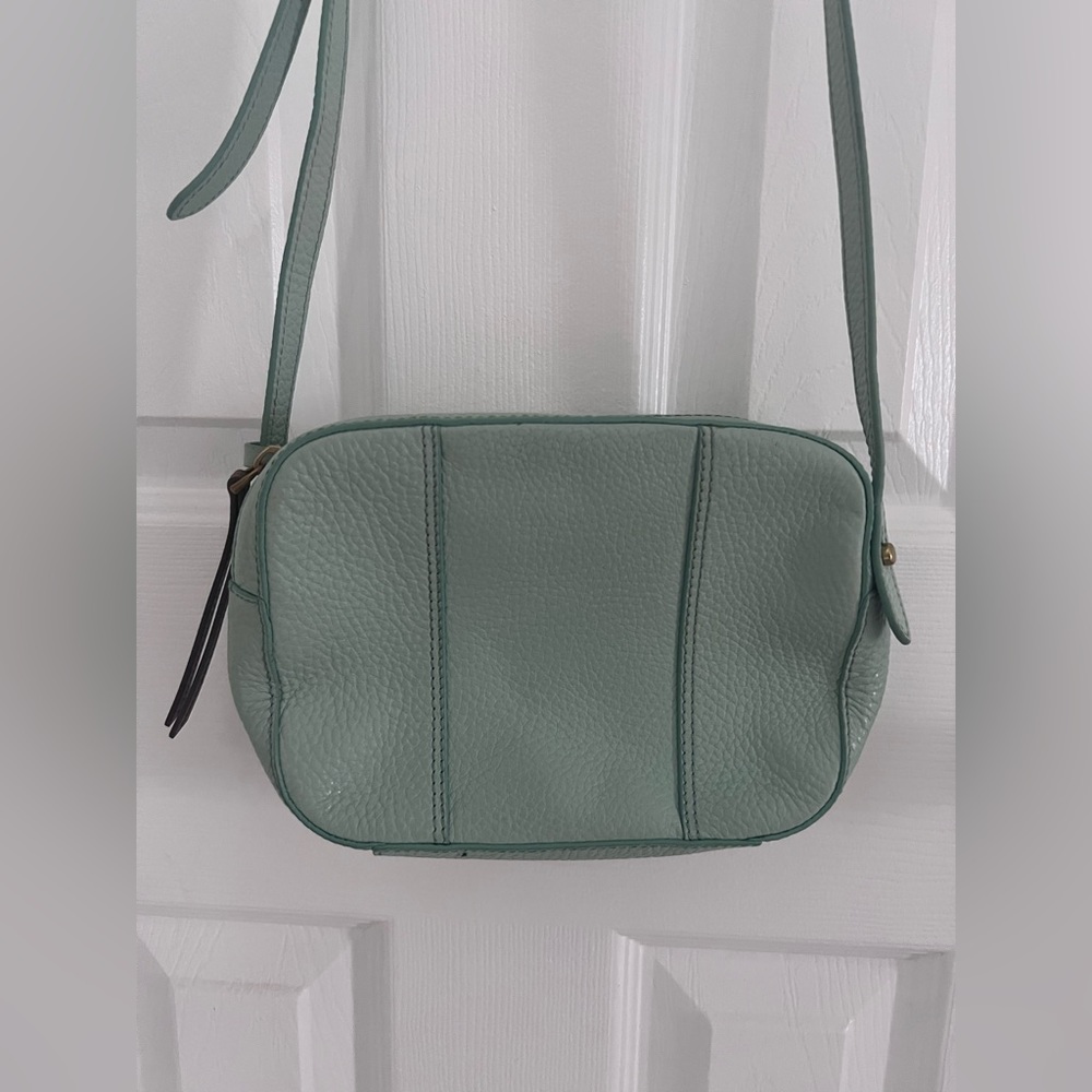 lightly used turquoise fossil cross body purse